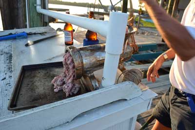 Chum exiting the grinder